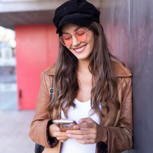 Woman smiling at her phone