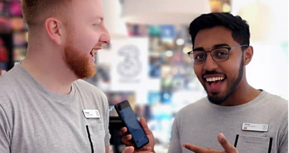 In-store advisors showing phone