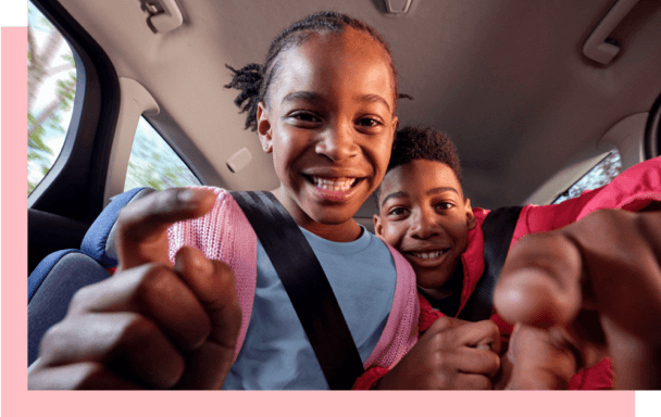 Kids using phone selfie camera in car